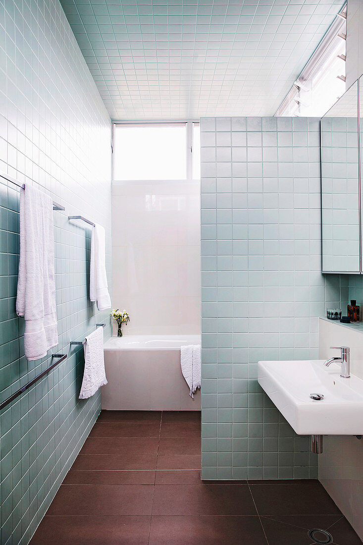 Bathroom with silver-gray wall tiles