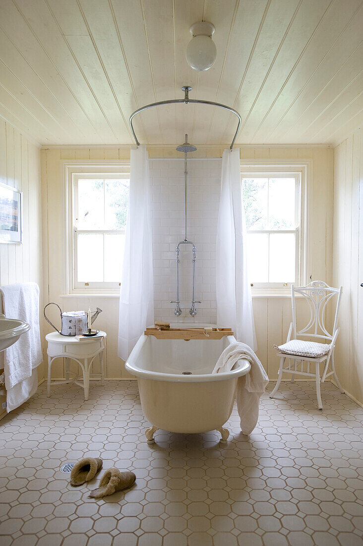 Free-standing bathtub in vintage-style, white bathroom