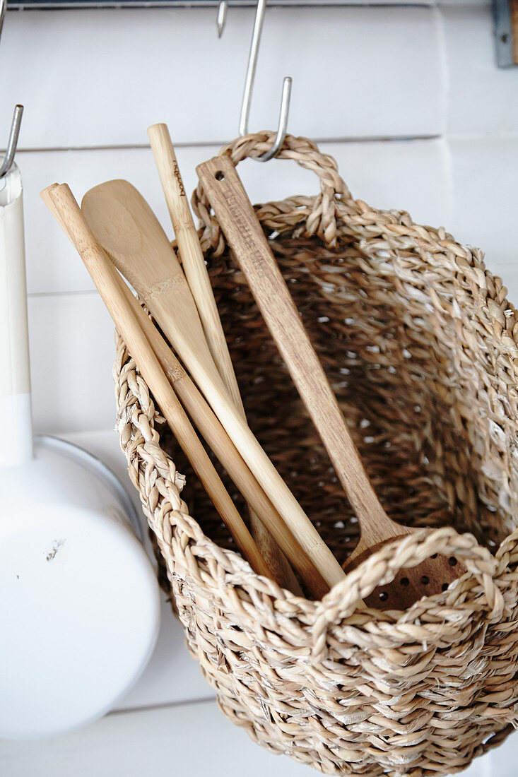 Wicker basket used to store kitchen utensils