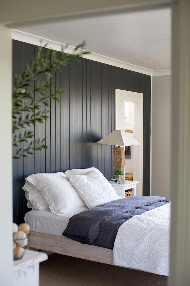 Rustic bedroom with black board wall