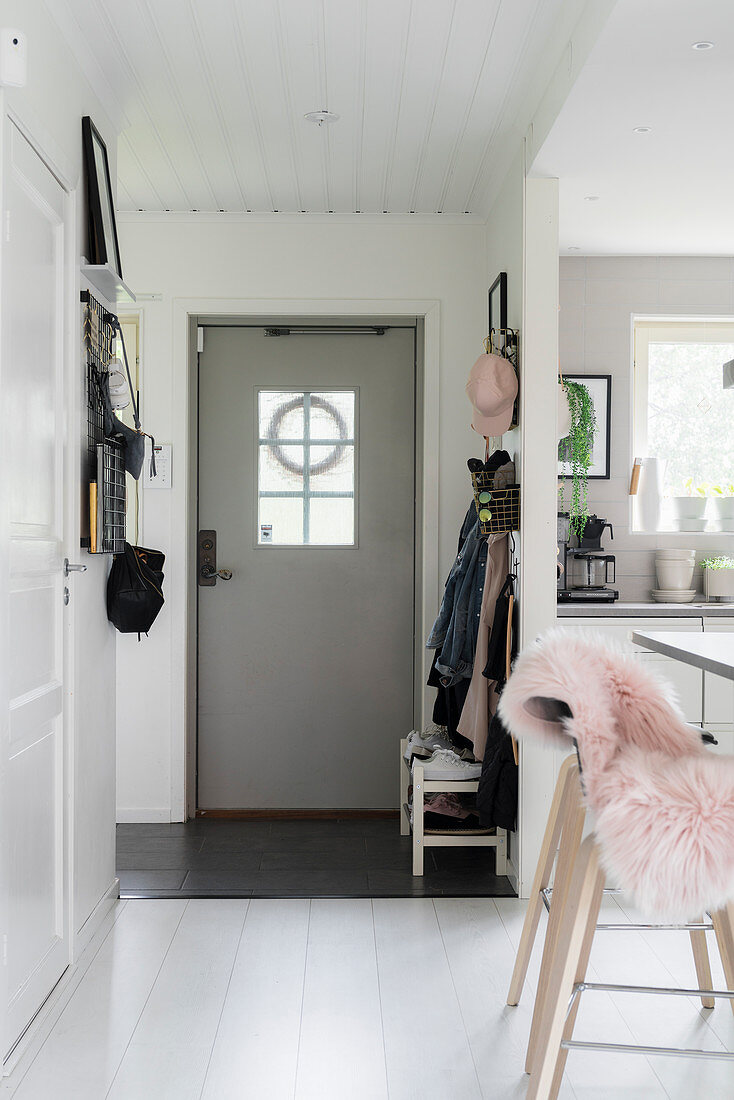 View from open-plan kitchen to grey front door