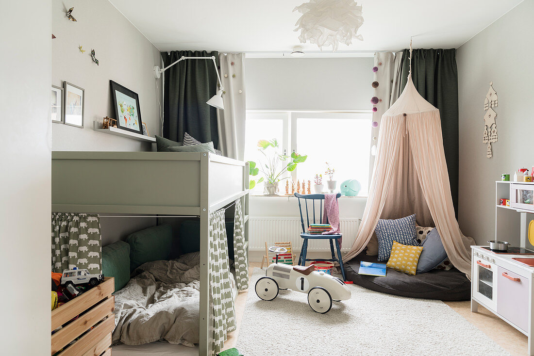 Loft bed, play area under canopy and vintage-style ride-on car