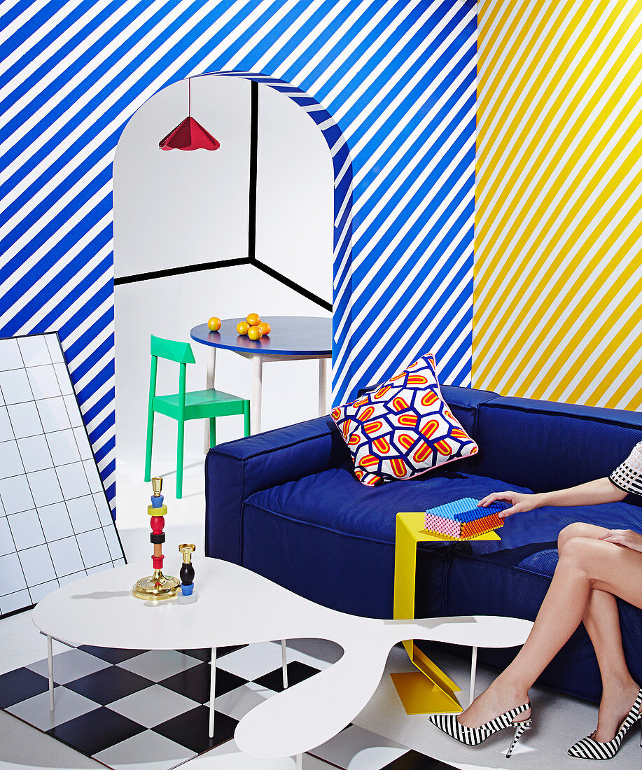 Diagonally striped walls in the brightly colored living room