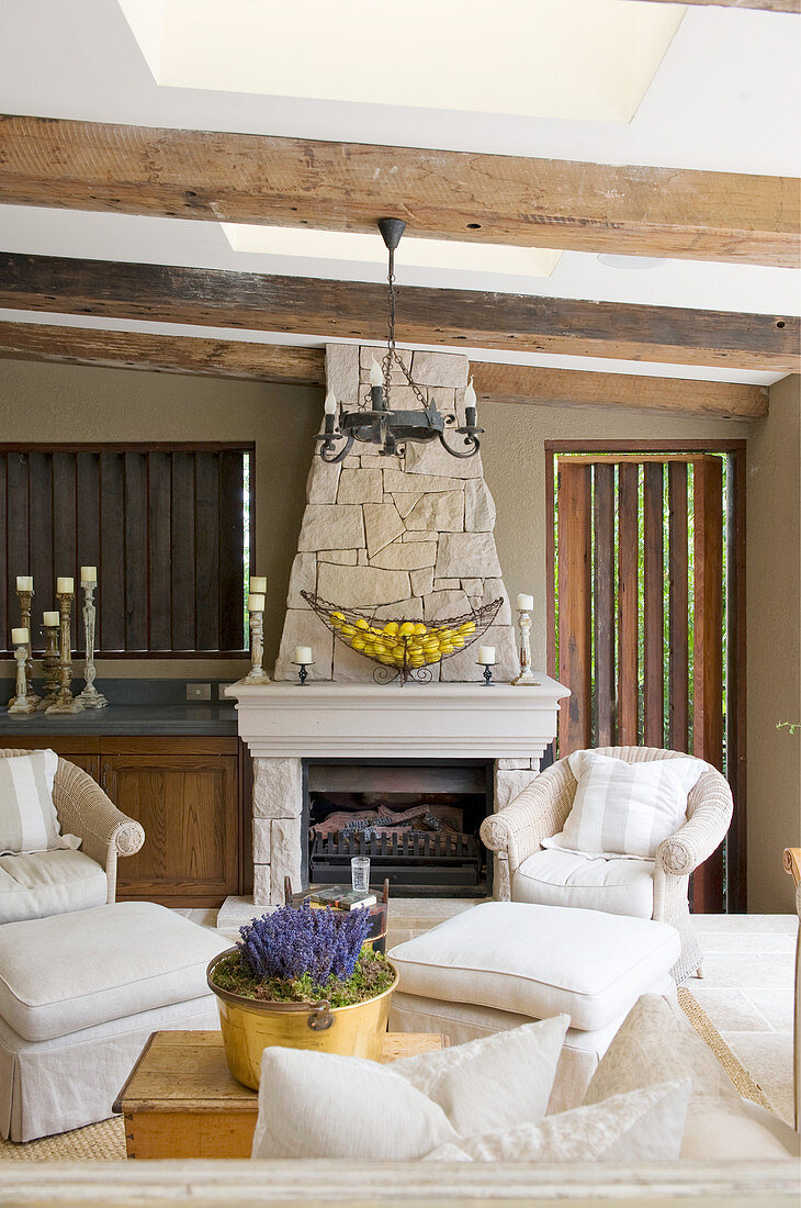 Open fireplace in rustic, elegant living room