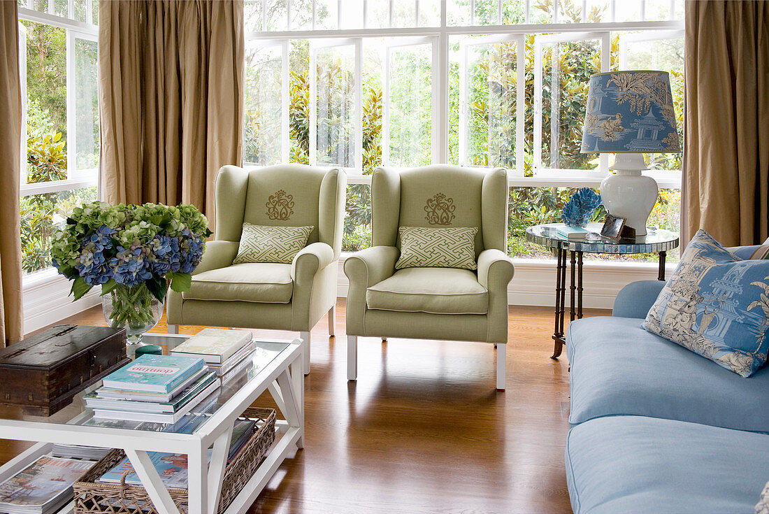 Upholstered seating in blue and green in classic living room