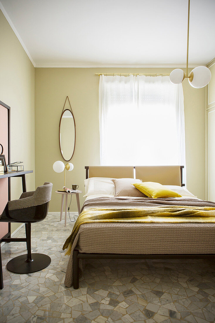 Bright, beige bedroom with stone floor