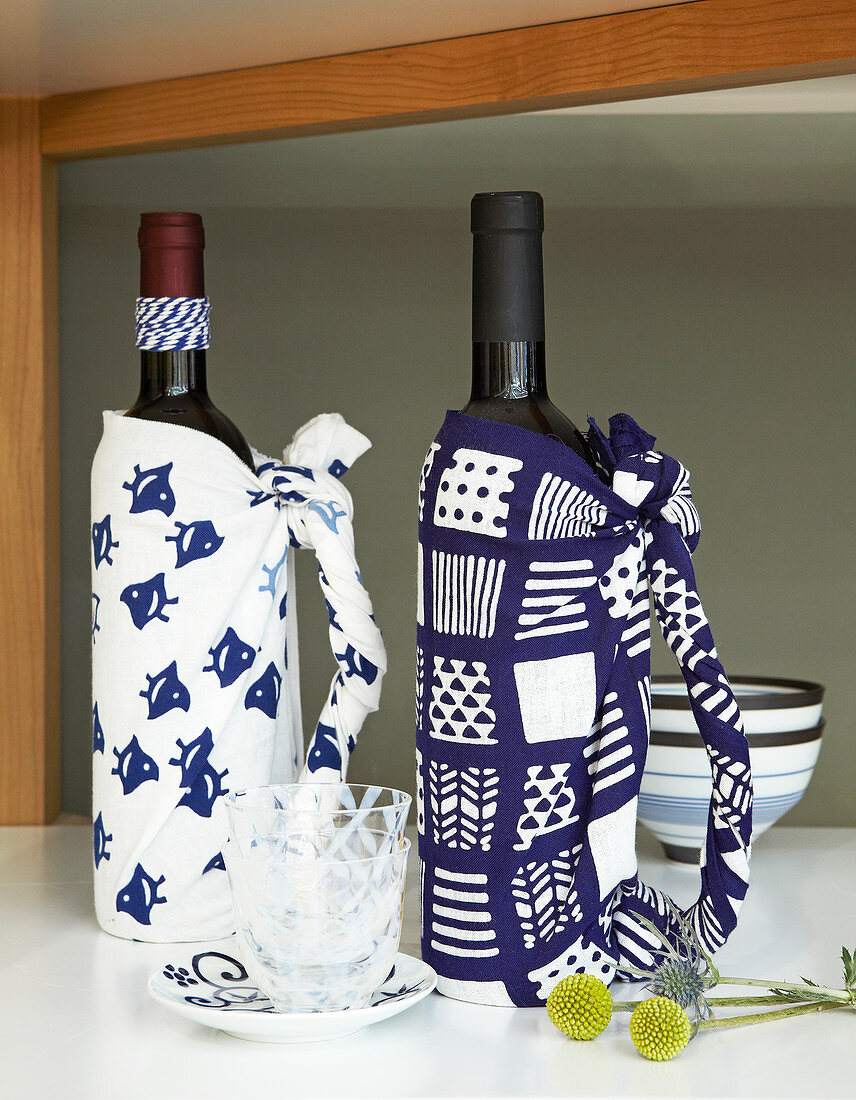 Bottles wrapped in patterned blue-and-white fabric