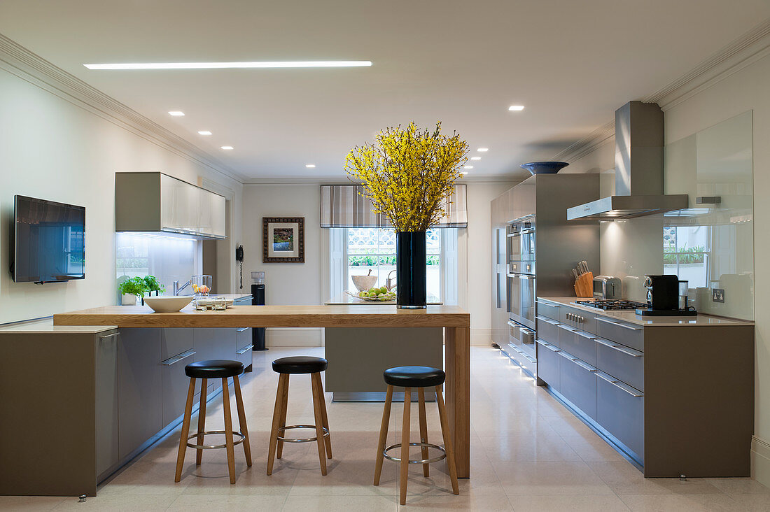 Modern kitchen with breakfast bar and stools