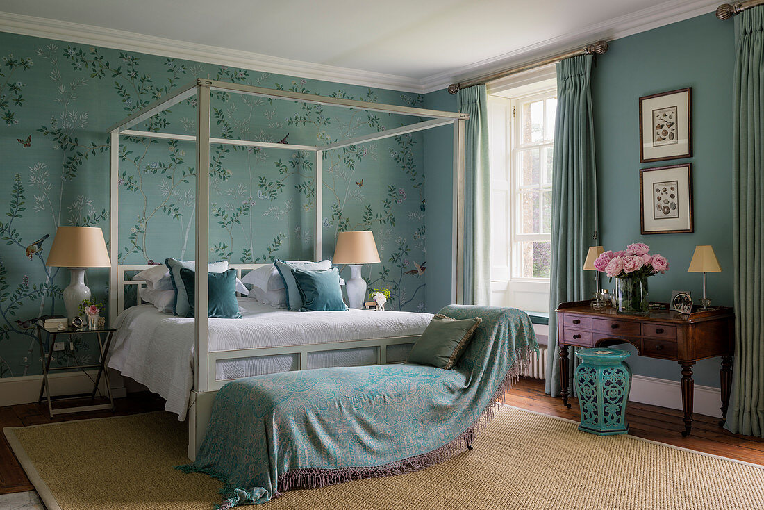 Silk wallpaper in elegant bedroom with four poster bed and sisal rug