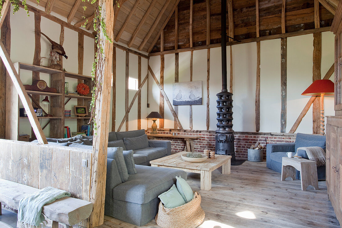 Living room in converted barn with timber frame