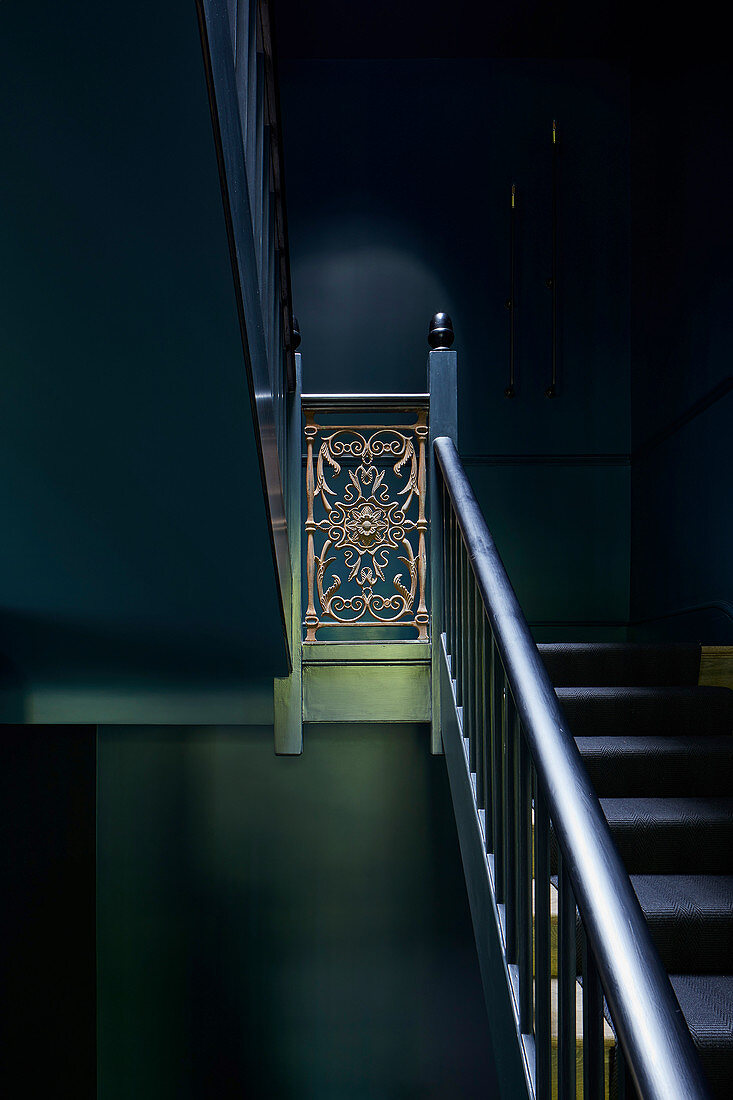 Dark stairwell with antique banister rail