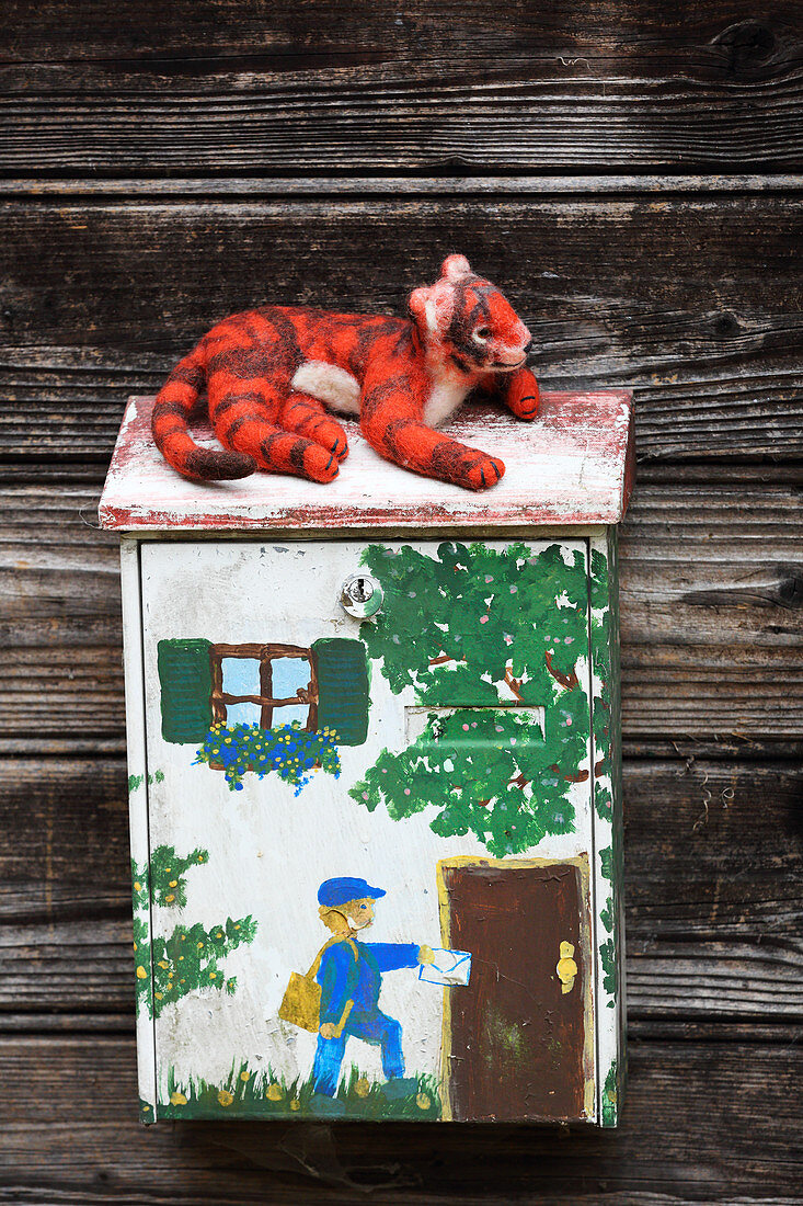 Hand-made, felted, woollen tiger on letterbox