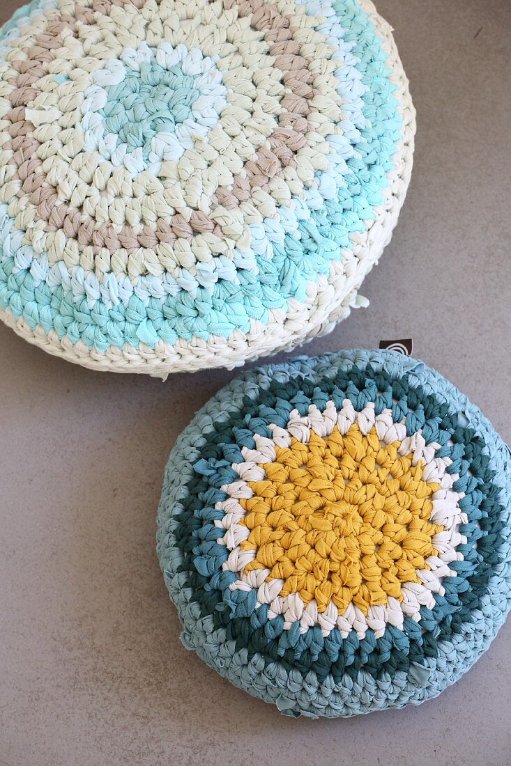 Crocheted cushions made from T-shirt yarn in shade of blue
