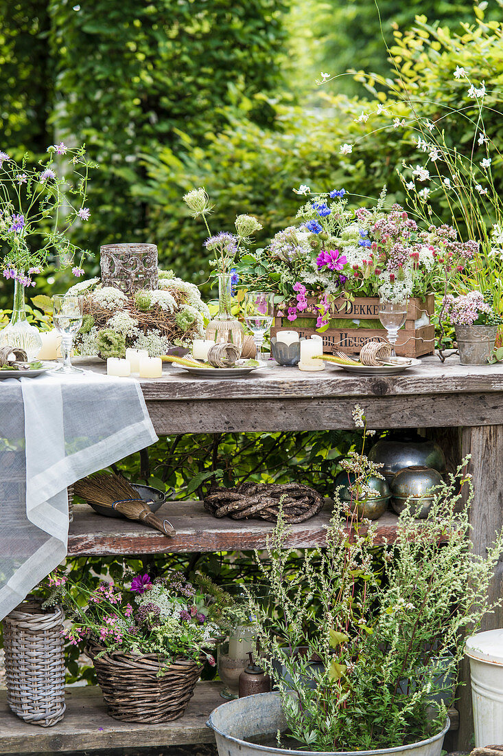 Table set with wildflowers in garden