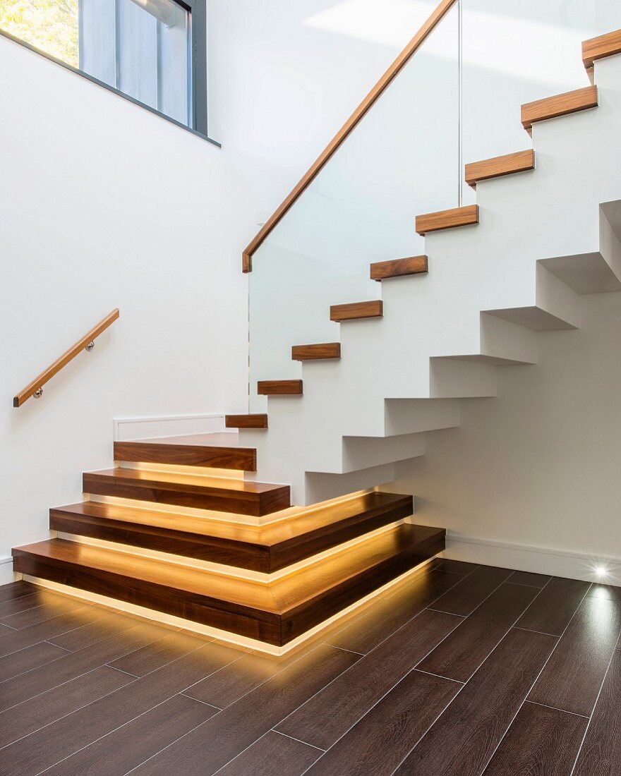 Modern staircase with wooden treads and underlights