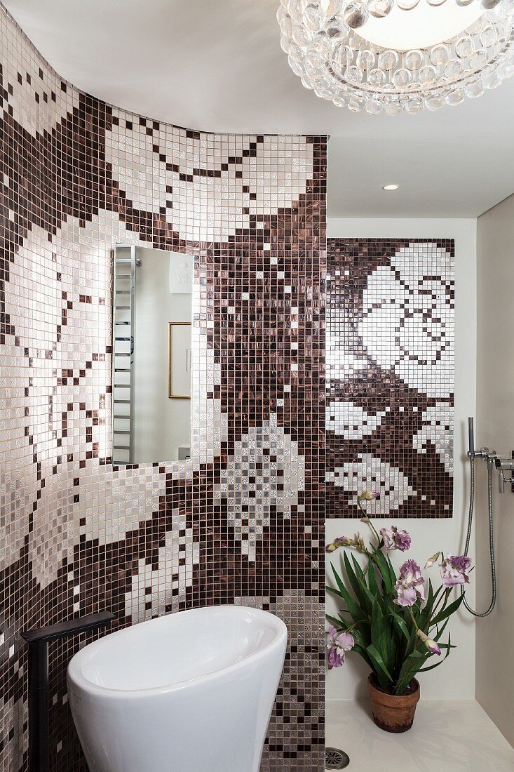 Mosaic walls with floral pattern in modern bathroom with curved walls