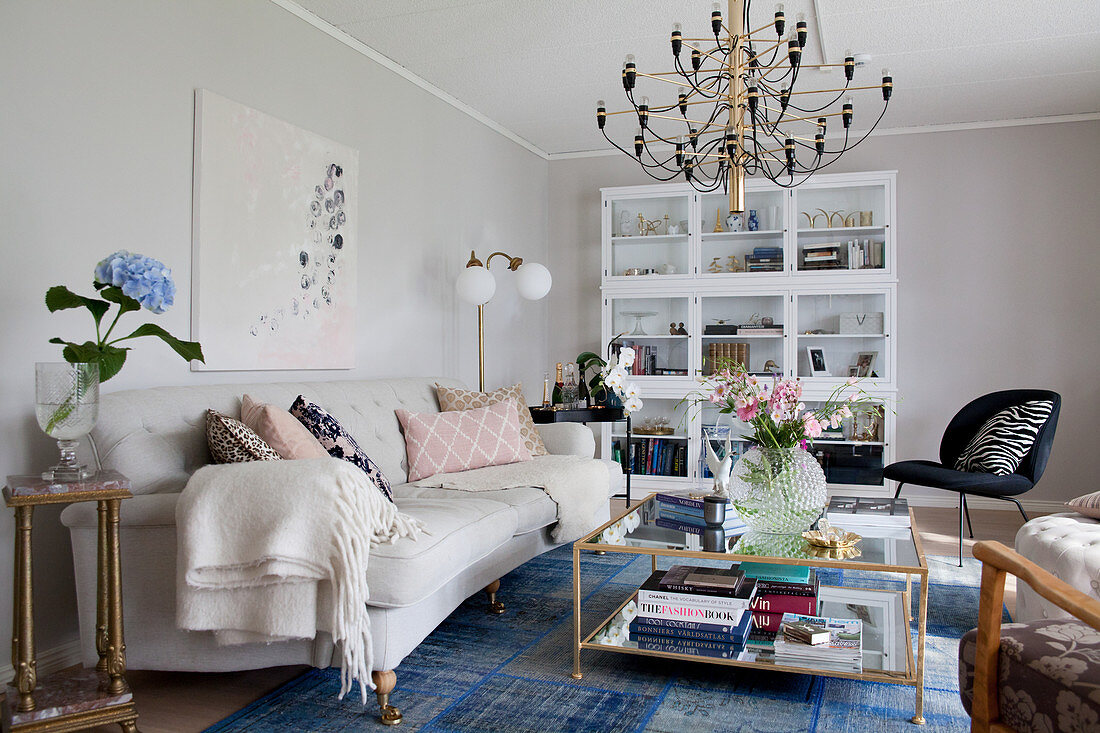 Pale sofa and blue rug in classic living room