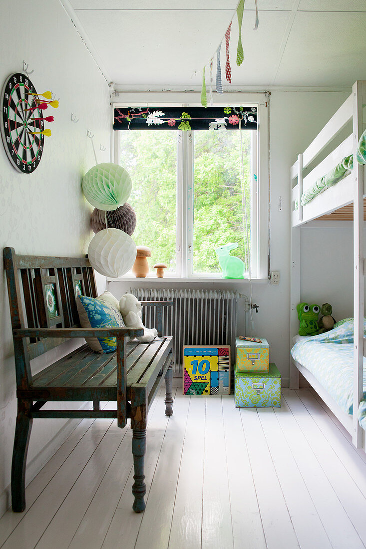 Wooden bench and bunk beds in children's bedroom
