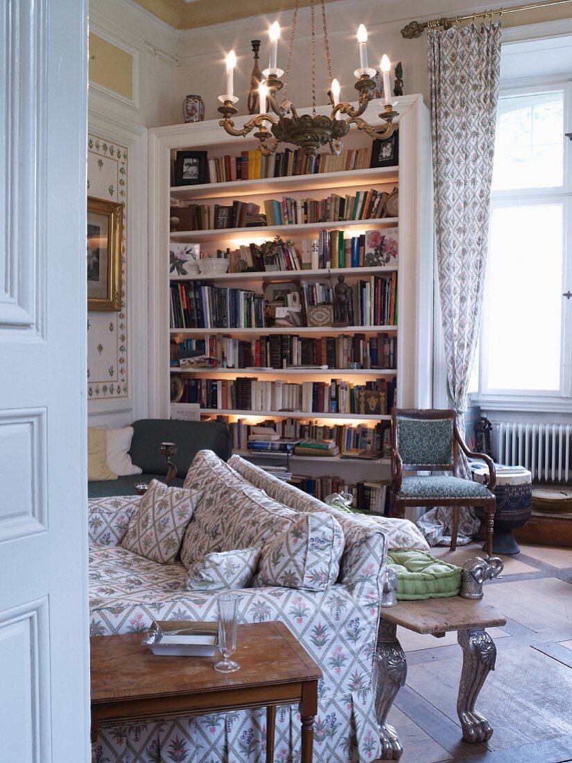 Illuminated bookcase in classic living room