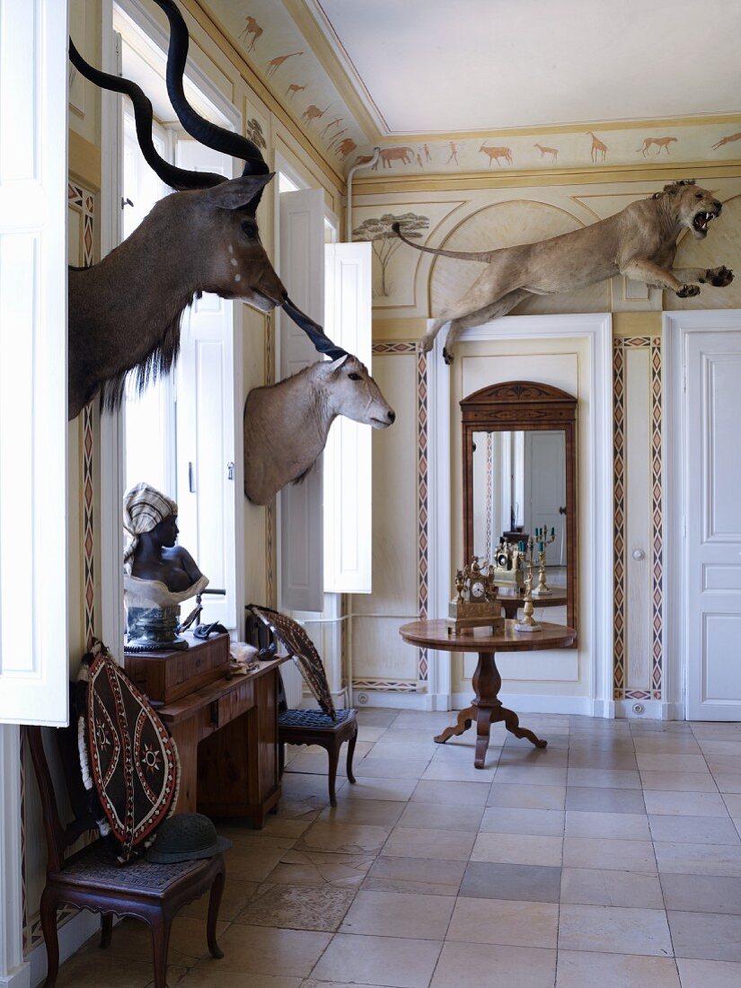 Grand interior of castle decorated with African hunting trophies