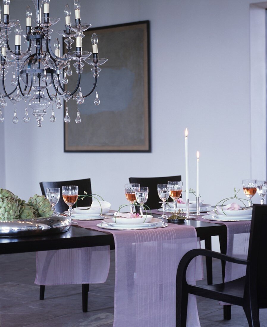 Chandelier above table festively set with pink runners