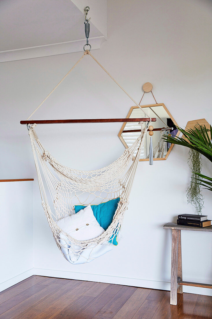 Hammock in front of a wall mirror