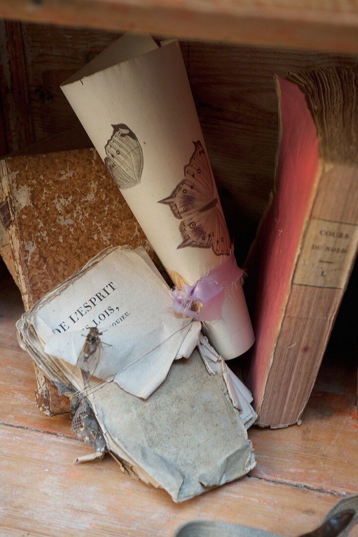 Vintage books and bookpages tied with ribbon