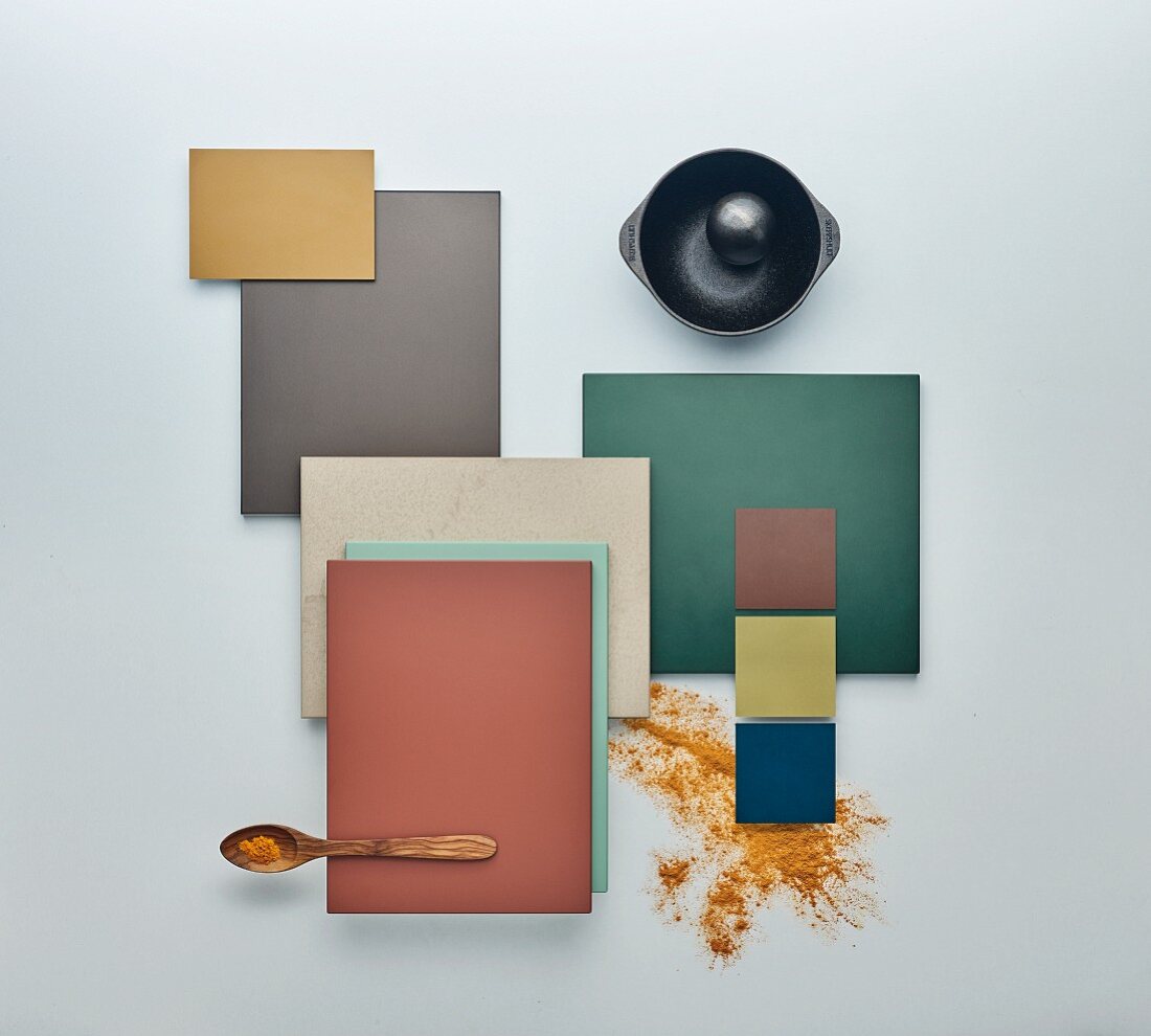 A colourful selection of kitchen cabinet panels and a cast-iron mortar