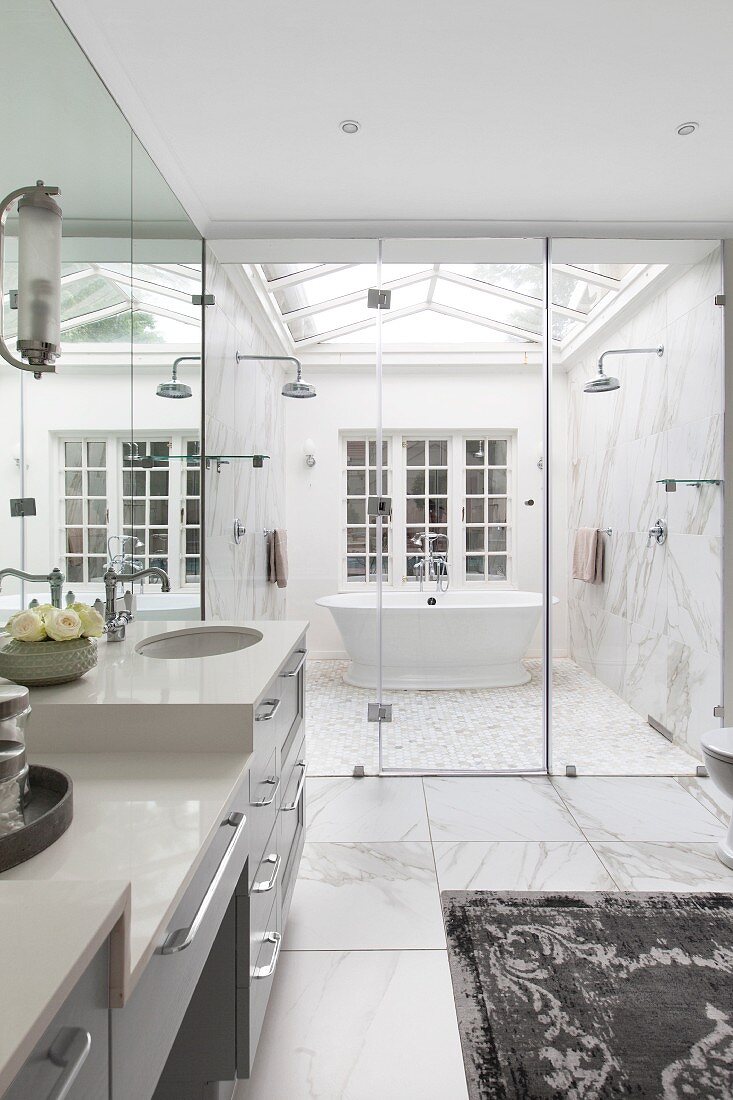 Luxurious bathroom with ridge skylight over free-standing bathtub