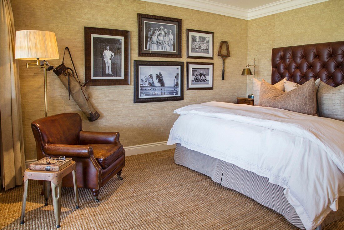 Antique sporting gear and vintage photos in elegant bedroom