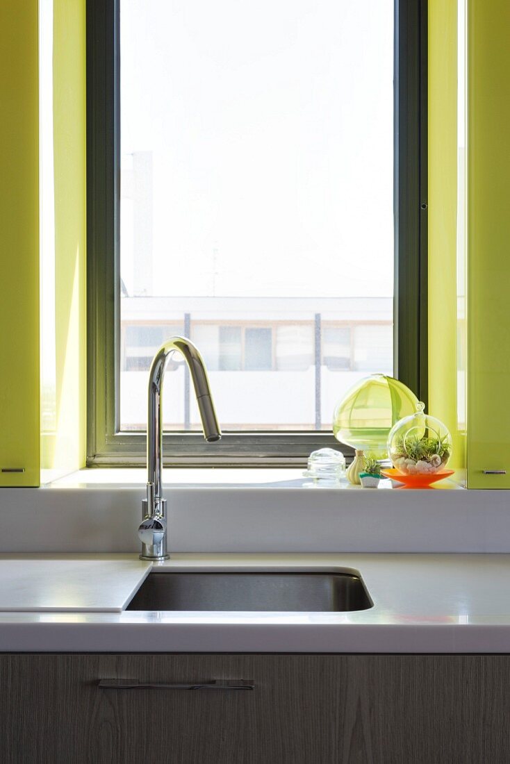 Sink with sliding cover below window
