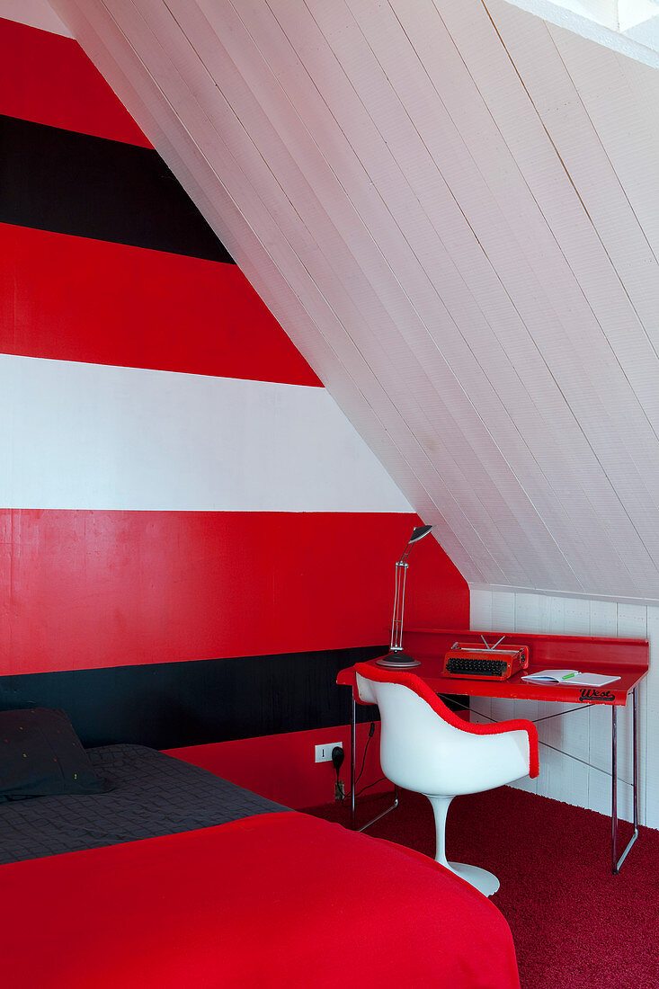 Red, white and black stripes on wall in attic bedroom