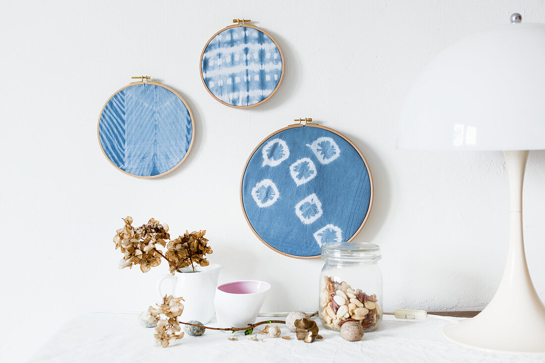 Hand-made wall decorations made from embroidery rings and old handkerchiefs hand-dyed using Shibori technique