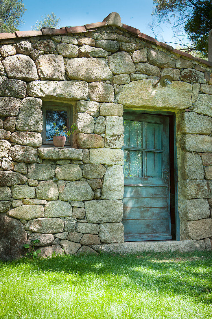 Stone house in Mediterranean landscape