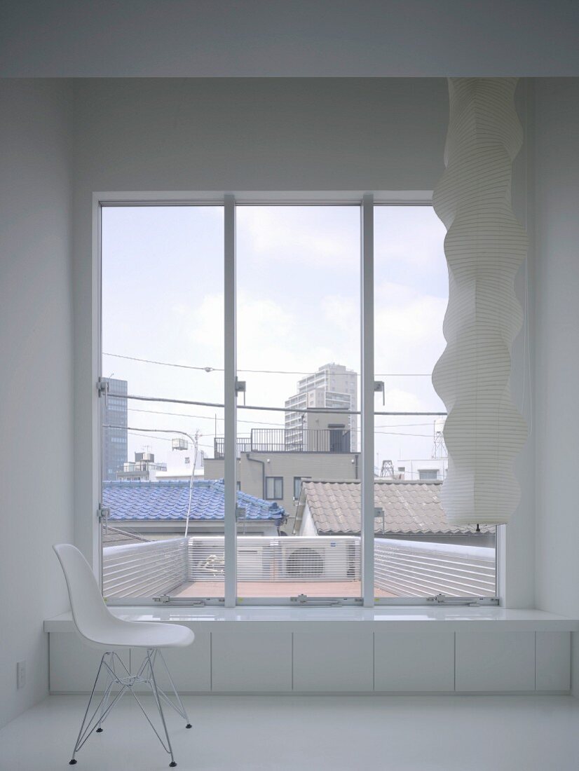 Chair next to window with view of Tokyo, Japan