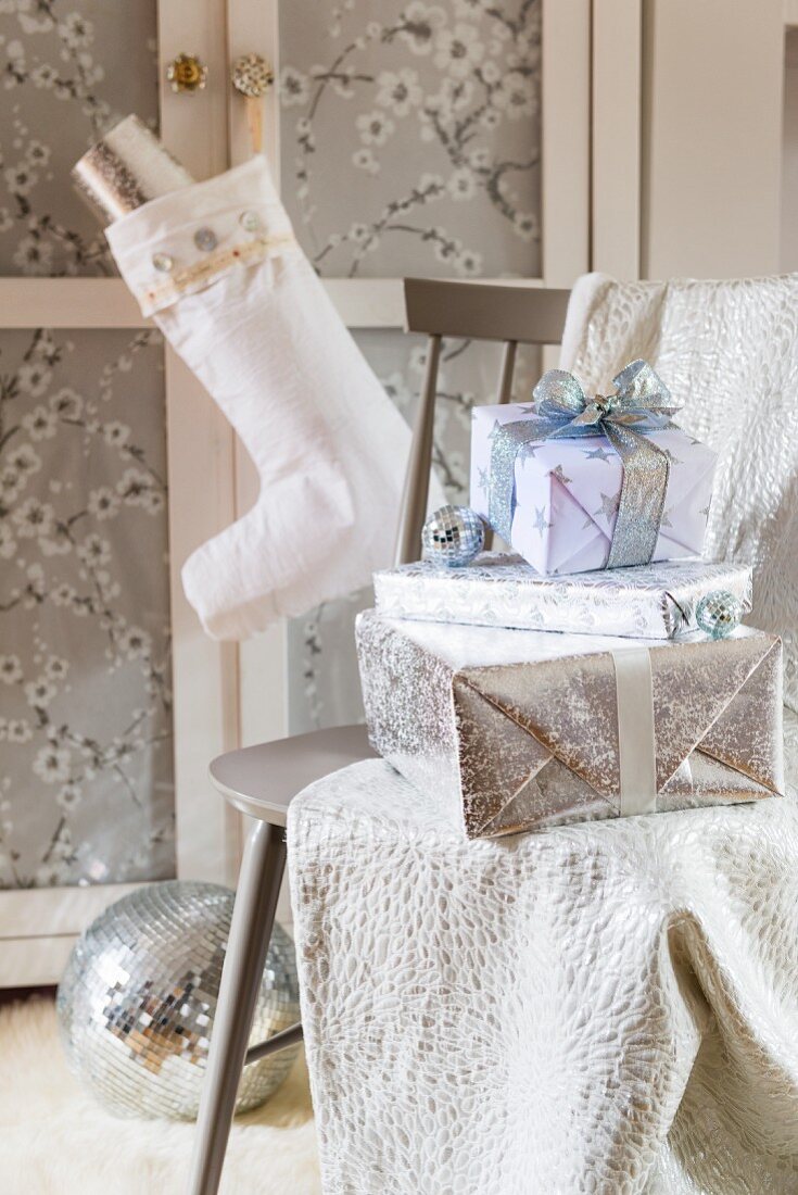 Stack of presents wrapped in white and silver