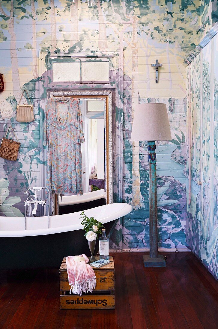 Artistically painted wood paneling in bohemian bathroom
