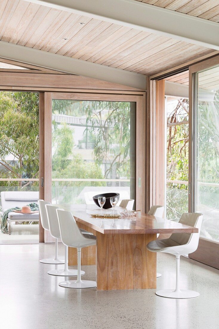 Modern dining room with window fronts and nature views