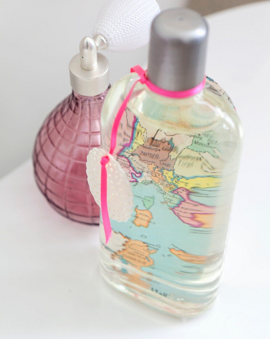 Bottle of soap and retro perfume atomiser