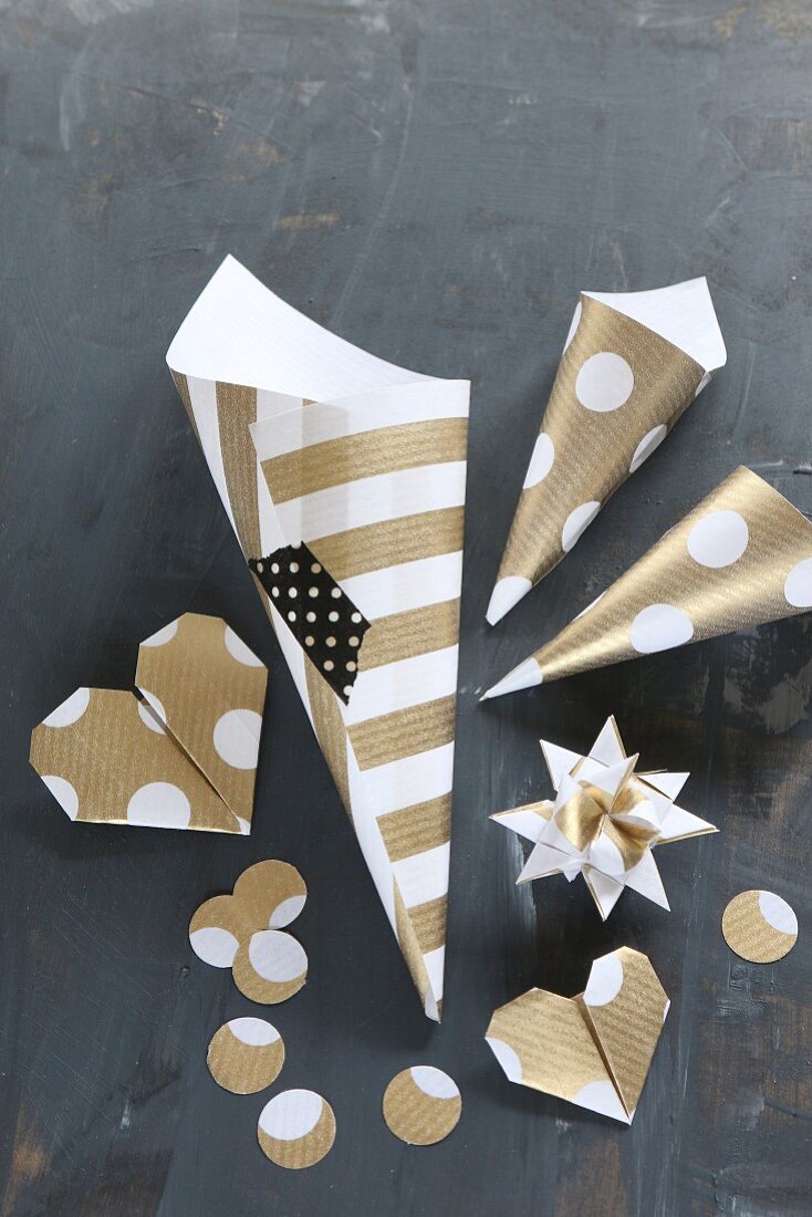 Hand-made Christmas decorations: 3D star, origami hearts and paper cones