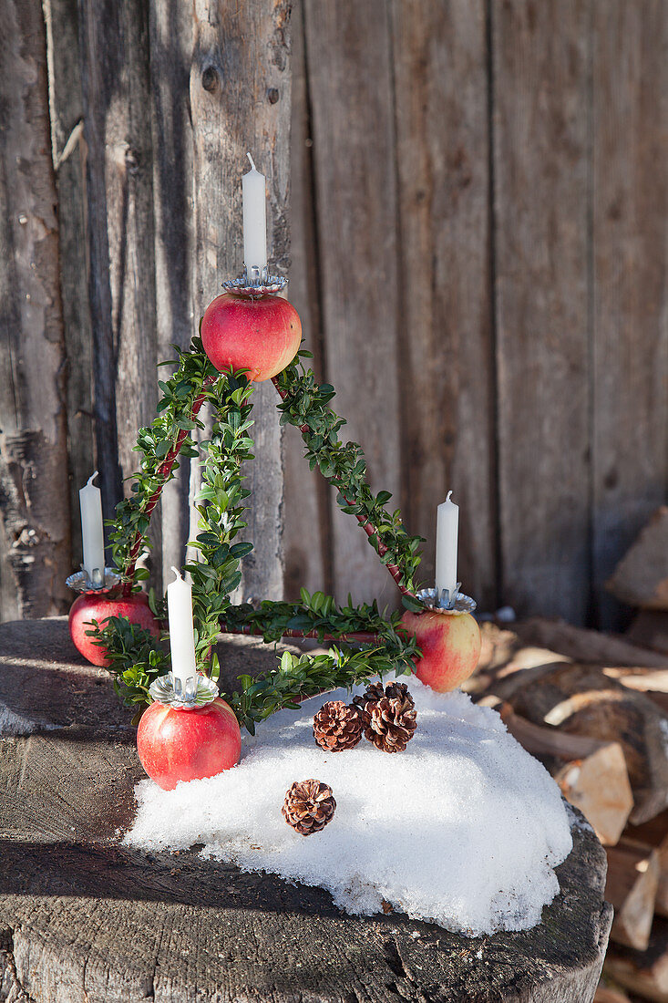 Pyramid Advent arrangement made from apples and box twigs