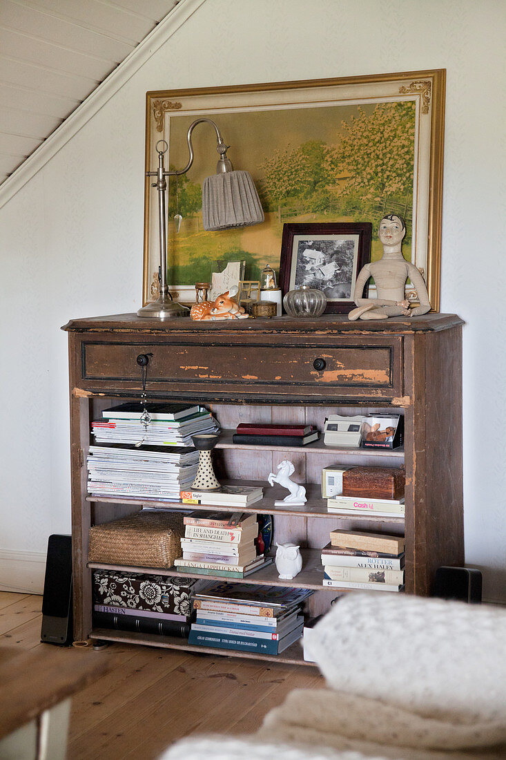 Old chest of drawers used as shelves without drawers in living room