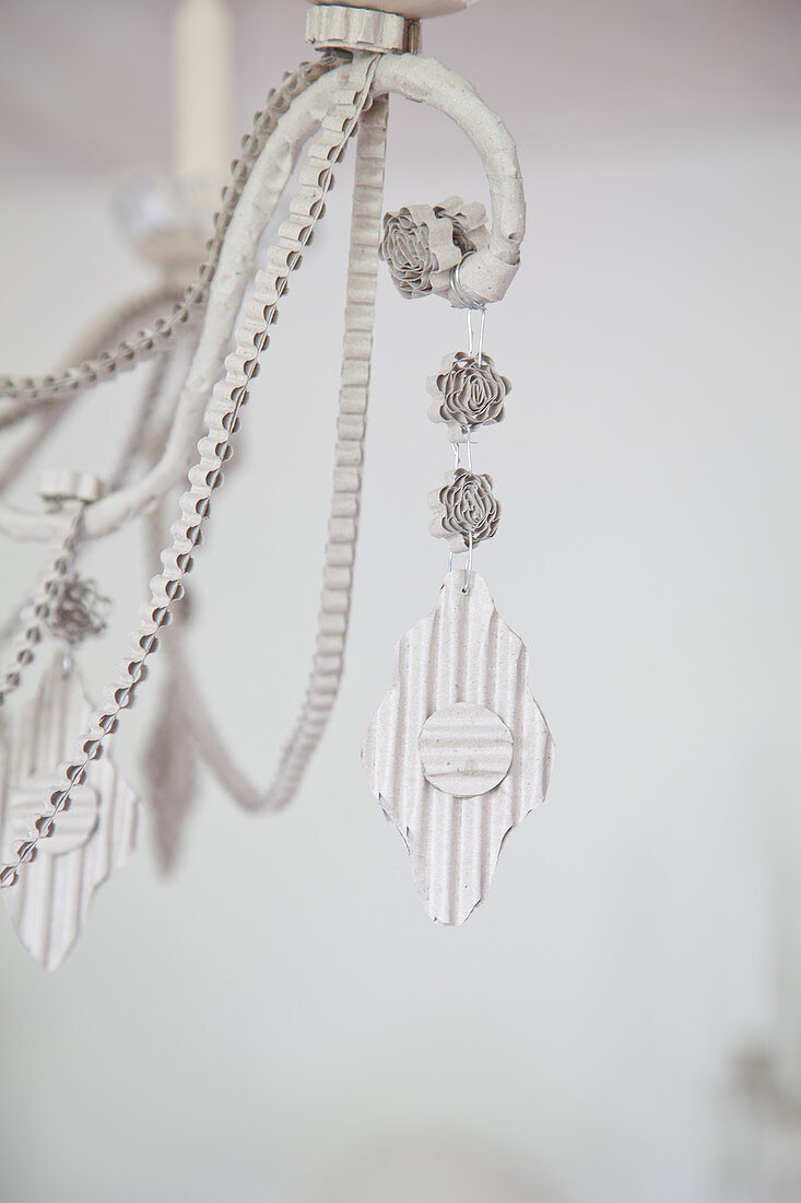 Detail of chandelier with ornaments made from corrugated cardboard