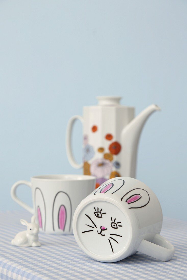 Mugs painted with bunny faces and ears