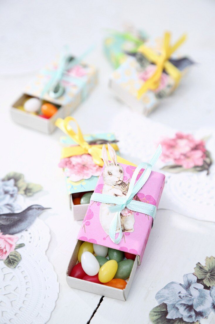 Sugar eggs in matchboxes covered in coloured paper as gifts