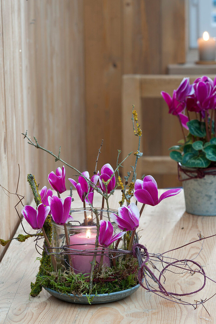 Preserving jar used as a lantern, decorated with flowers