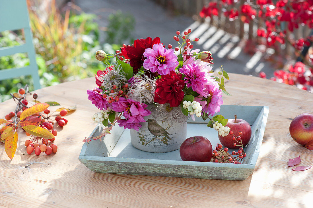 Autumnal dahlia bouquet on wooden tray