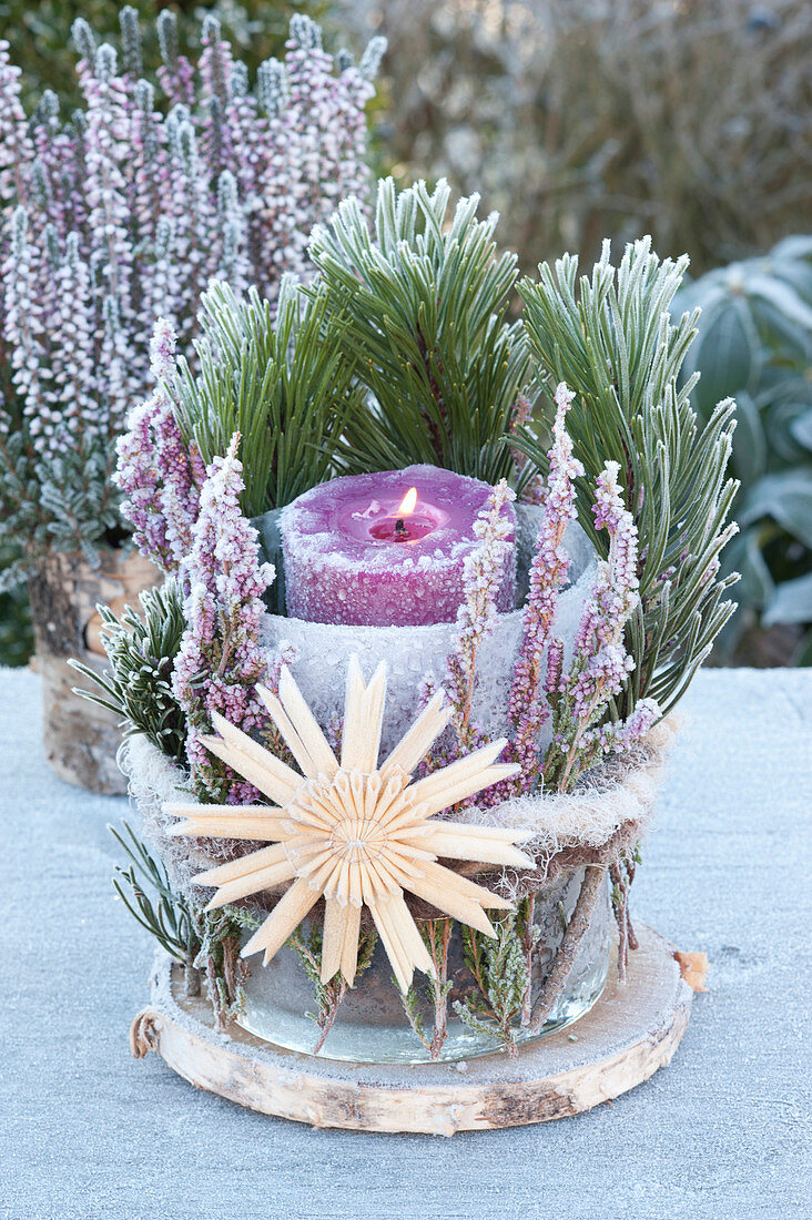 Advent decoration outside with broom heath and straw star
