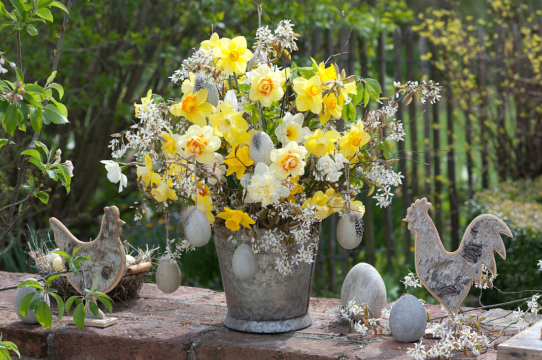 Yellow-white spring bouquet in zinc pot