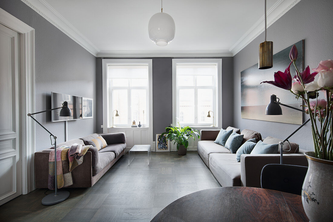 Two sofas facing one another in living room in shades of grey